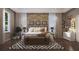 Comfortable bedroom with modern decor, a decorative headboard, and ample natural light, creating a relaxing atmosphere at 4112 Southern Valley Loop, Brooksville, FL 34601