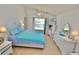 Bedroom with a large window overlooking a pond, ceiling fan, and relaxing decor at 4429 Whitton Way, New Port Richey, FL 34653