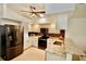 Well-lit kitchen features stainless steel appliances, granite countertops, and ample cabinet space at 4429 Whitton Way, New Port Richey, FL 34653