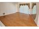 Bright living room with hardwood flooring, a sliding glass door, and neutral wall colors at 5227 Kirkwood Ave, Spring Hill, FL 34608