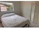 This bedroom features neutral tile flooring and a closet with sliding doors at 5249 Courtland Rd, Spring Hill, FL 34608