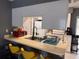 Bright kitchen with breakfast bar, updated appliances, and ample counter space at 5249 Courtland Rd, Spring Hill, FL 34608