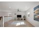Spacious living room featuring modern ceiling fan, recessed lighting, and ample natural light at 5360 Riverwalk Preserve Dr, New Port Richey, FL 34653