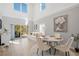 Bright living space with a dining area and access to a sliding glass door leading to an outdoor patio at 5360 Riverwalk Preserve Dr, New Port Richey, FL 34653