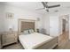Comfortable main bedroom with ceiling fan, natural light, and neutral decor at 5360 Riverwalk Preserve Dr, New Port Richey, FL 34653