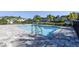 Community pool with pool deck and railing provides a refreshing amenity for residents at 5360 Riverwalk Preserve Dr, New Port Richey, FL 34653