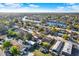 Stunning aerial view of a waterfront community with access to the bay, showcasing the neighborhood's layout and proximity to water at 5523 Cheyenne Dr, Holiday, FL 34690