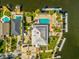 An aerial view of a stunning home with a pool, lush landscaping, multiple docks, and Gulf access at 5557 Sea Forest Dr # 318, New Port Richey, FL 34652