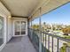 Relaxing condo balcony overlooking the community pool and a view of the surrounding landscape at 5557 Sea Forest Dr # 318, New Port Richey, FL 34652