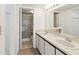 Bright bathroom with double sinks and updated vanity at 5557 Sea Forest Dr # 318, New Port Richey, FL 34652