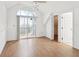 Bedroom featuring vaulted ceilings, balcony access, and closet at 5557 Sea Forest Dr # 318, New Port Richey, FL 34652