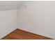 Empty closet with wire shelving and hardwood floors providing practical storage space at 5557 Sea Forest Dr # 318, New Port Richey, FL 34652