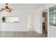 Open concept floor plan with views into the kitchen area, modern lighting and neutral paint at 5557 Sea Forest Dr # 318, New Port Richey, FL 34652