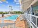 Beautiful pool with outdoor seating and lush landscaping, perfect for relaxation at 5557 Sea Forest Dr # 318, New Port Richey, FL 34652