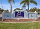 Entrance sign to Gulf Harbors, a deed restricted waterfront community with lush landscaping at 5557 Sea Forest Dr # 318, New Port Richey, FL 34652