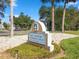 Gulf Landings Recreation Center sign with manicured landscaping and a bright blue sky welcomes association members at 5557 Sea Forest Dr # 318, New Port Richey, FL 34652