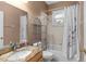 Bathroom featuring a combination shower and tub with a shower curtain at 5737 Wynstone Ln, Zephyrhills, FL 33541