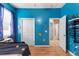 Bright bedroom with a view of a doorway and large closet featuring colorful decor at 5737 Wynstone Ln, Zephyrhills, FL 33541