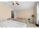 Bedroom featuring a ceiling fan, carpet, and dresser between the bed and the closet at 5737 Wynstone Ln, Zephyrhills, FL 33541