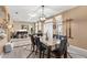Formal dining room with a large table and chairs, piano, and lots of natural light at 5737 Wynstone Ln, Zephyrhills, FL 33541