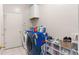 Bright laundry room featuring a washer and dryer, storage, and convenient organization at 5737 Wynstone Ln, Zephyrhills, FL 33541
