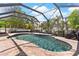 Stunning screened pool and patio, ready for outdoor enjoyment, with lush landscaping surrounding at 5737 Wynstone Ln, Zephyrhills, FL 33541