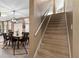 Interior of the home featuring a staircase leading upstairs next to the dining room at 5737 Wynstone Ln, Zephyrhills, FL 33541