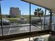 Relax on your screened balcony and enjoy the waterfront views and the tropical palm trees at 5956 Seaside Dr, New Port Richey, FL 34652
