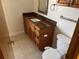 Traditional bathroom featuring a vanity with a granite countertop and ample storage, plus toilet with bidet at 5956 Seaside Dr, New Port Richey, FL 34652