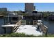 Dock with modern boat lift, offering serene water views and convenient access to boating and water activities at 5956 Seaside Dr, New Port Richey, FL 34652