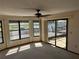 Living room has views of the water and boat docks from windows and sliding doors at 5956 Seaside Dr, New Port Richey, FL 34652