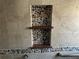 Close up of shower niche with decorative pebble detail and tile accents on a remodeled shower at 5956 Seaside Dr, New Port Richey, FL 34652