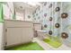 Cozy bathroom with floral shower curtain, a toilet, and a single sink vanity at 6652 Brambleleaf Dr, Spring Hill, FL 34606