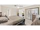 Bedroom featuring a ceiling fan, dresser, closet, and sliding door leading to outside at 6652 Brambleleaf Dr, Spring Hill, FL 34606