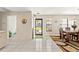 Welcoming entryway area featuring views of the dining room and front door at 6652 Brambleleaf Dr, Spring Hill, FL 34606
