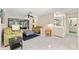 Cozy living room area features tile flooring, neutral walls, and access to other areas of the home at 6652 Brambleleaf Dr, Spring Hill, FL 34606