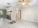 Inviting living room featuring tile flooring, a brick fireplace, and neutral paint at 7150 Park Dr, New Port Richey, FL 34652