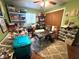 Green bedroom featuring hardwood floors and neutral rug at 8053 Hixton Dr, Port Richey, FL 34668