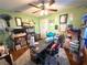 Bedroom features green walls, ceiling fan, and personal decorations at 8053 Hixton Dr, Port Richey, FL 34668