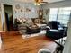 Comfortable living room with a sectional couch and a view of the birch-tree wall design at 8053 Hixton Dr, Port Richey, FL 34668
