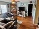Cozy living room features a TV, display cabinet, and comfortable seating arrangements at 8053 Hixton Dr, Port Richey, FL 34668