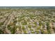 Expansive aerial view showcasing a tranquil residential neighborhood near the ocean at 8121 Casuarina Dr, Port Richey, FL 34668