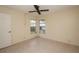 Neutral bedroom with tile floors and double window at 8121 Casuarina Dr, Port Richey, FL 34668