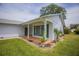 A charming single-story home with an inviting covered porch and well-maintained landscaping at 8121 Casuarina Dr, Port Richey, FL 34668