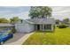 Charming single-story home boasting a tidy front lawn and a neatly paved driveway at 8121 Casuarina Dr, Port Richey, FL 34668