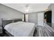 Comfortable bedroom featuring neutral tones, modern decor, and wood-look flooring at 8626 White Springs Dr, New Port Richey, FL 34655
