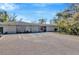 Well-maintained building exterior with ample parking and accessible entrance at 8626 White Springs Dr, New Port Richey, FL 34655
