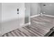 Entrance hallway featuring wood-look flooring at 8626 White Springs Dr, New Port Richey, FL 34655