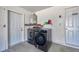 Convenient laundry room featuring a modern washer, dryer, and water heater at 8626 White Springs Dr, New Port Richey, FL 34655