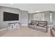 Inviting living room featuring a large television and comfortable seating at 8626 White Springs Dr, New Port Richey, FL 34655